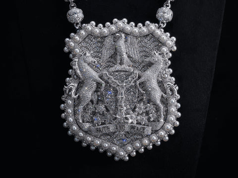 Asake's Nigeria Coat of Arms pendant by A Jewellers, the national emblem in pavé diamonds, white gold and pearls