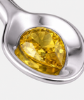 Pear cut yellow sapphire bezel set into the bowl of the spoon