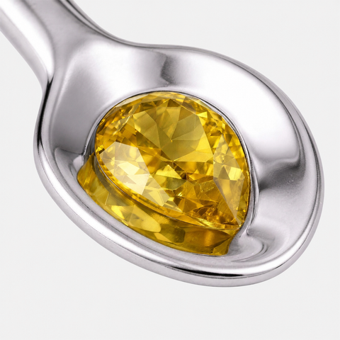 Pear cut yellow sapphire bezel set into the bowl of the spoon