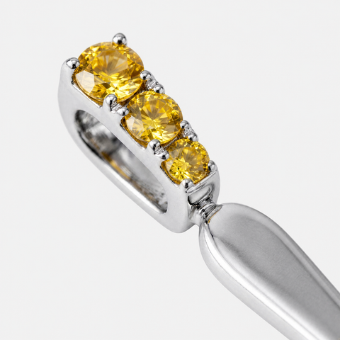 Three round yellow sapphires claw set into the bail