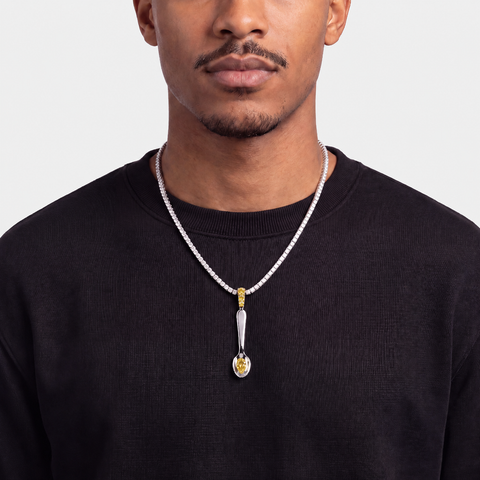 Yellow sapphire spoon pendant worn on a diamond tennis chain