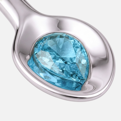Pear cut blue topaz bezel set into the bowl of the spoon