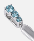 Three round blue topaz stones claw set into the bail
