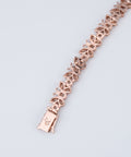 Reverse of the diamond butterfly bracelet showing open back settings and engraved clasp