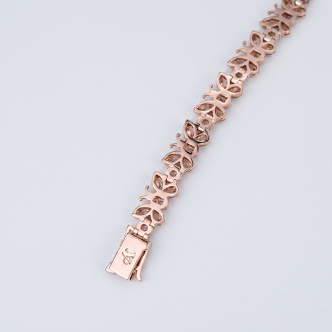 Reverse of the diamond butterfly bracelet showing open back settings and engraved clasp