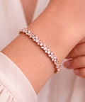 Diamond butterfly bracelet in 9ct rose gold worn on model