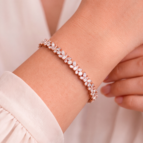 Diamond butterfly bracelet in 9ct rose gold worn on model