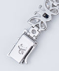 Butterfly link and clasp macro detail with engraved A Jewellers monogram