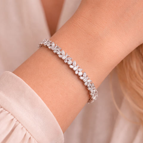 Diamond butterfly bracelet in 9ct white gold worn on model