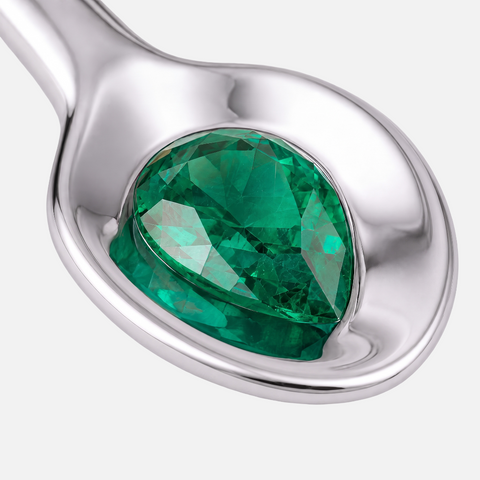 Pear cut emerald bezel set into the bowl of the spoon