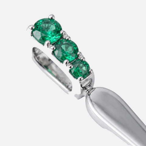 Three round emeralds claw set into the bail