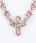 Diamond cross pendant close up on the 9ct rose gold cross chain