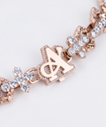 Rose gold cross chain clasp set with diamonds, with the A Jewellers logo