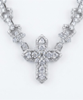Diamond cross pendant close up on the 9ct white gold cross chain