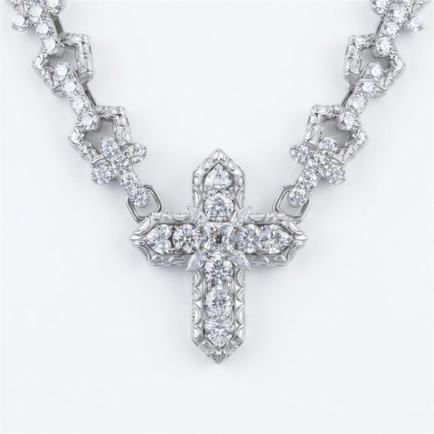 Diamond cross pendant close up on the 9ct white gold cross chain