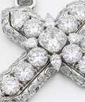 Cross pendant macro detail with cushion, round, oval, pear and heart cut diamonds