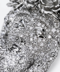 Pave set face detail with round and pear cut diamonds