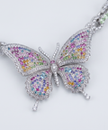Butterfly pendant angled close up with diamonds and fancy coloured gemstones